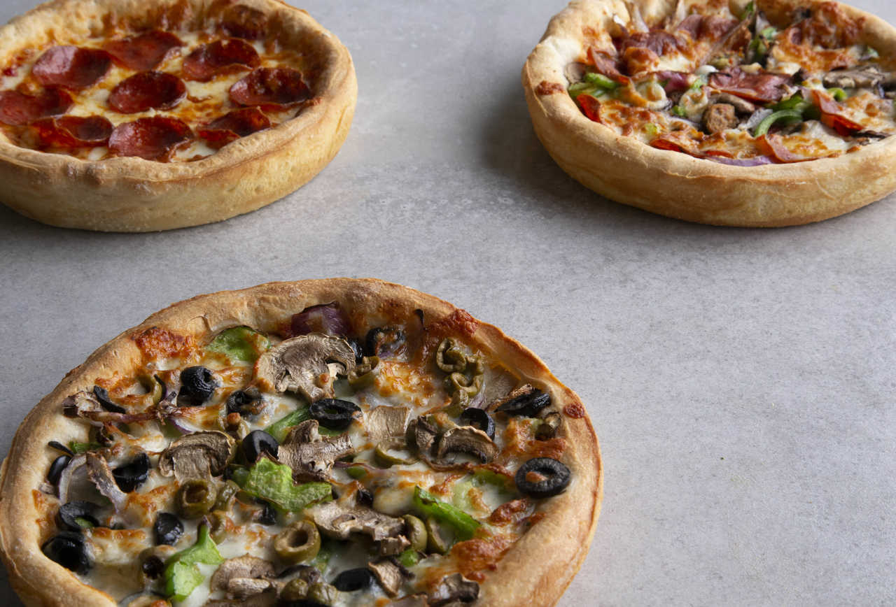 Pizza bros. Fresh brothers sizzering. Pizza with a lot of toppings.