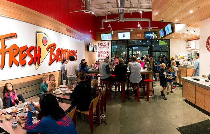 interior of Fresh Brothers with customers eating